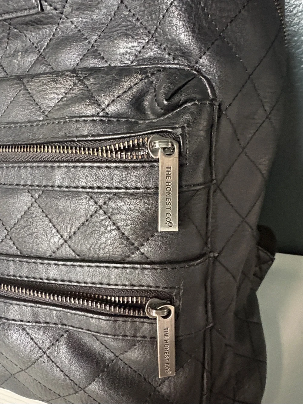 The Honest Company Diamond Quilted Black Faux Leather Backpack